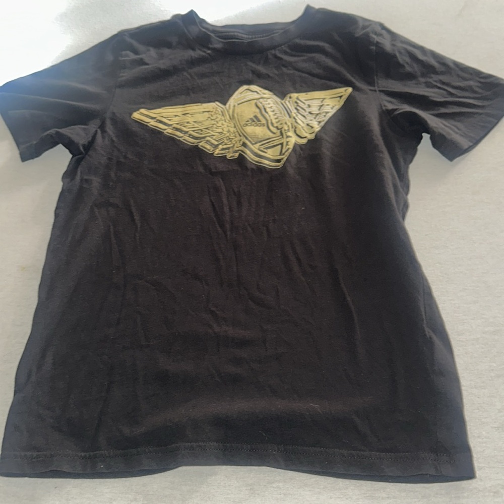 Kids Size Medium Adidas Black Tee with Gold Winged Emblem.